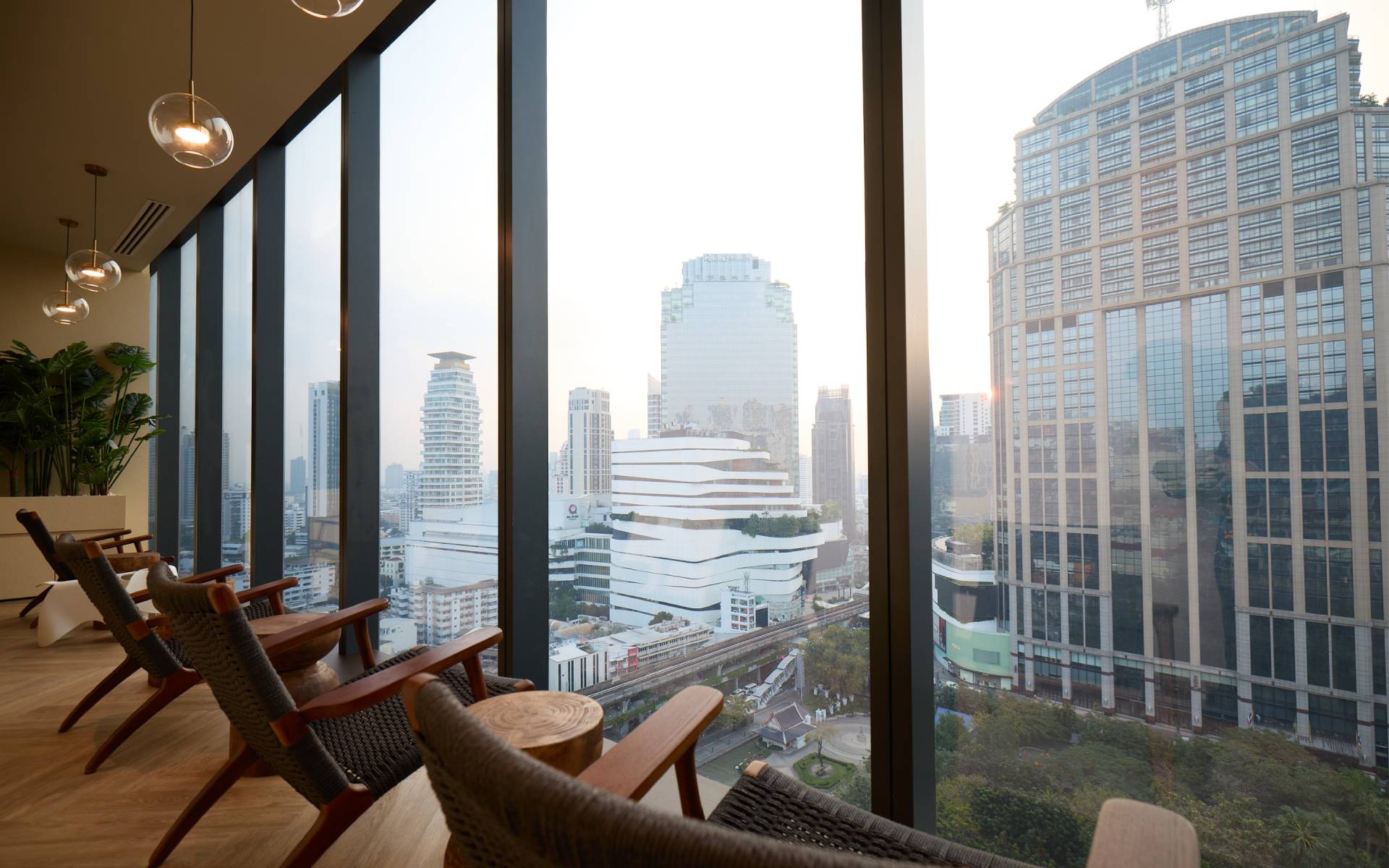 Nakhon Spa Bangkok EMSPHERE lounge with city and Benjasiri Park view