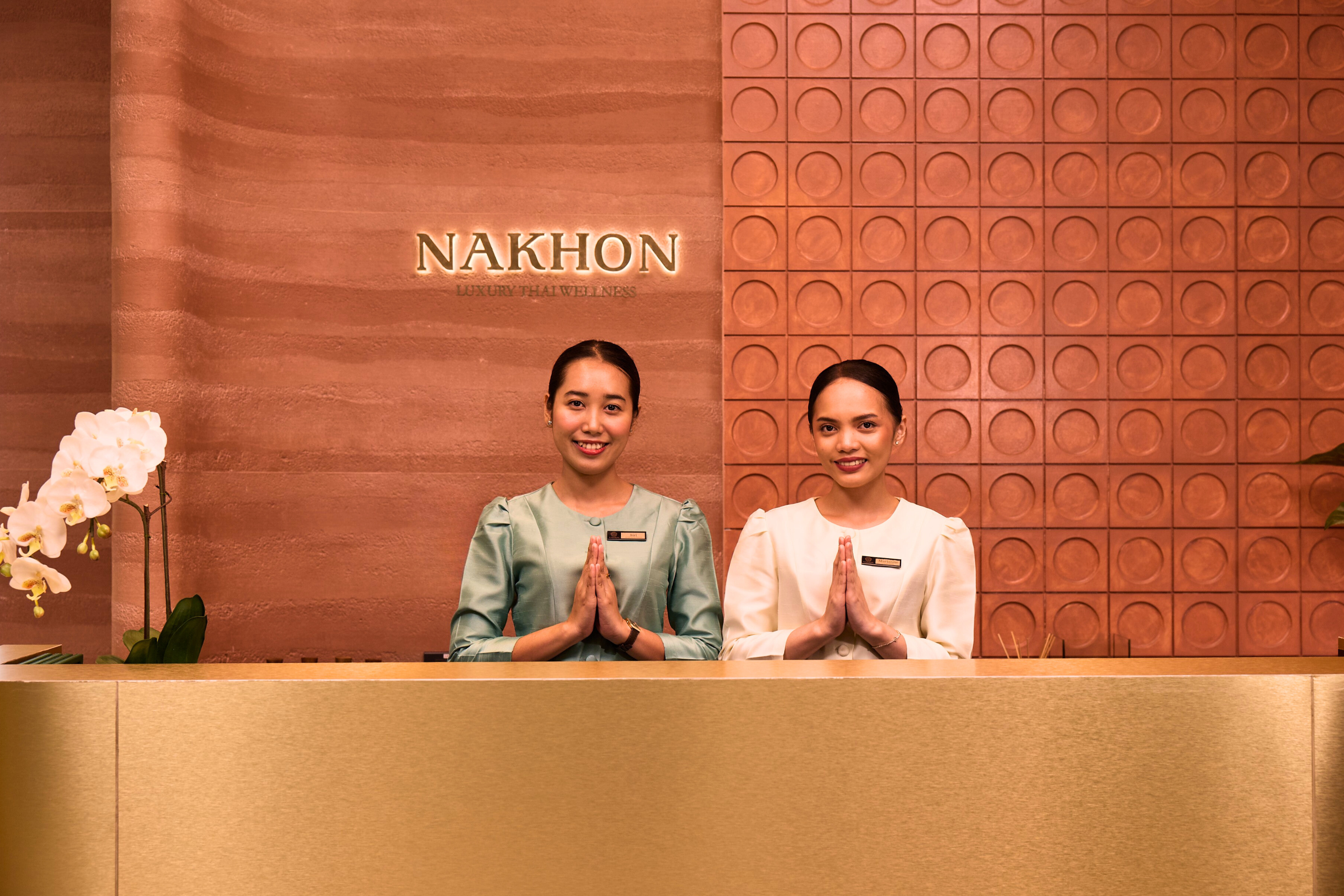 Nakhon Spa Bangkok reception with two therapists welcoming guests